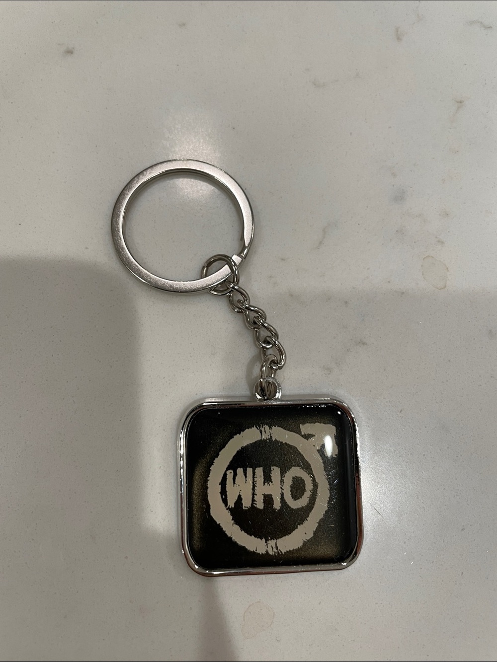 WHO Logo Square Keychain in Black and Silver